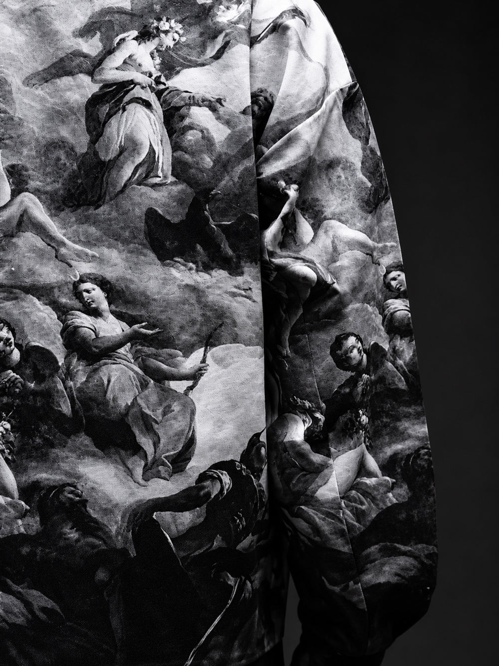 Close-up of monochrome classical-art print and jacket fabric