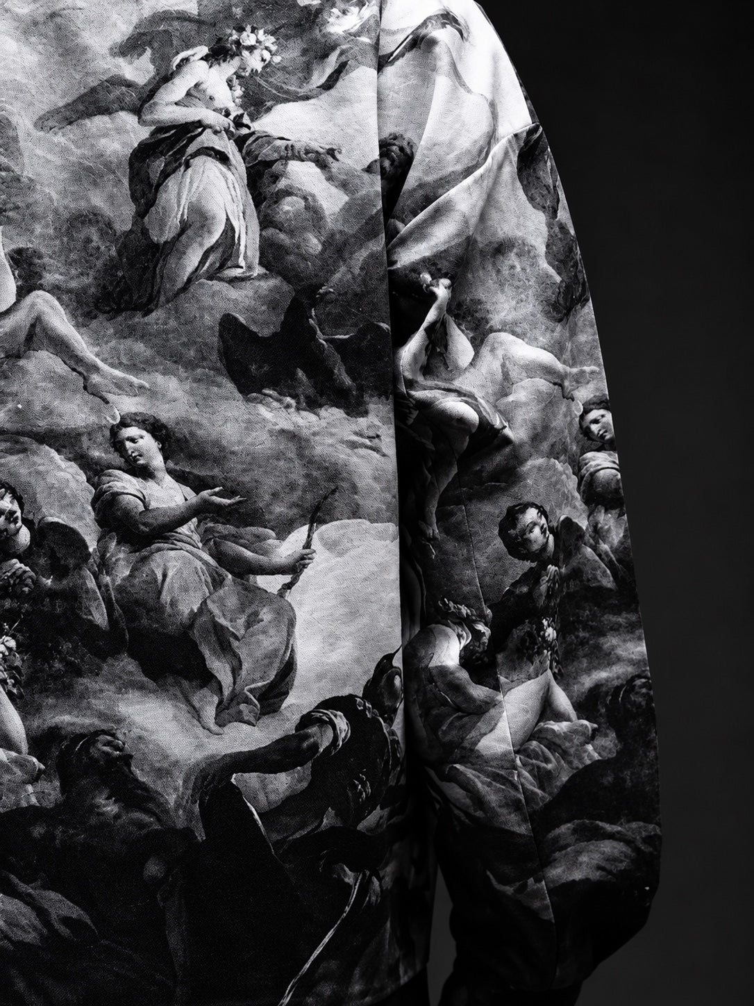 Close-up of monochrome classical-art print and jacket fabric