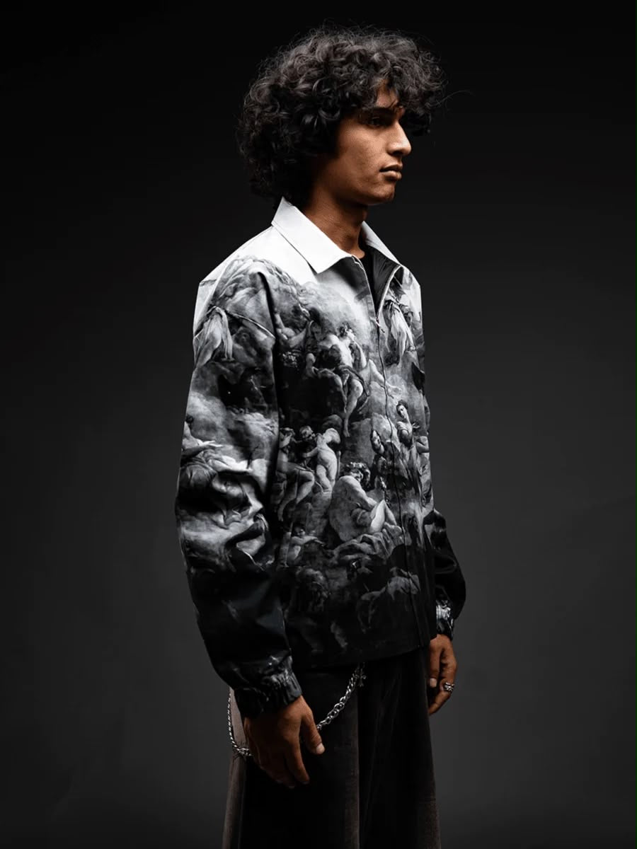 Three-quarter side view of monochrome art-print zip jacket